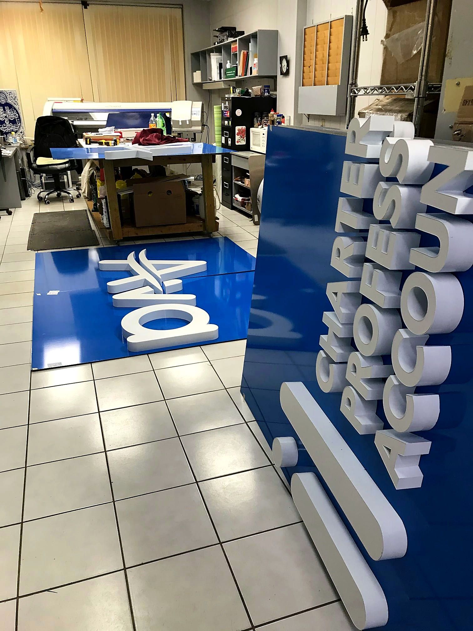 Avail sign panels and letters laid out in the SK Signs shop