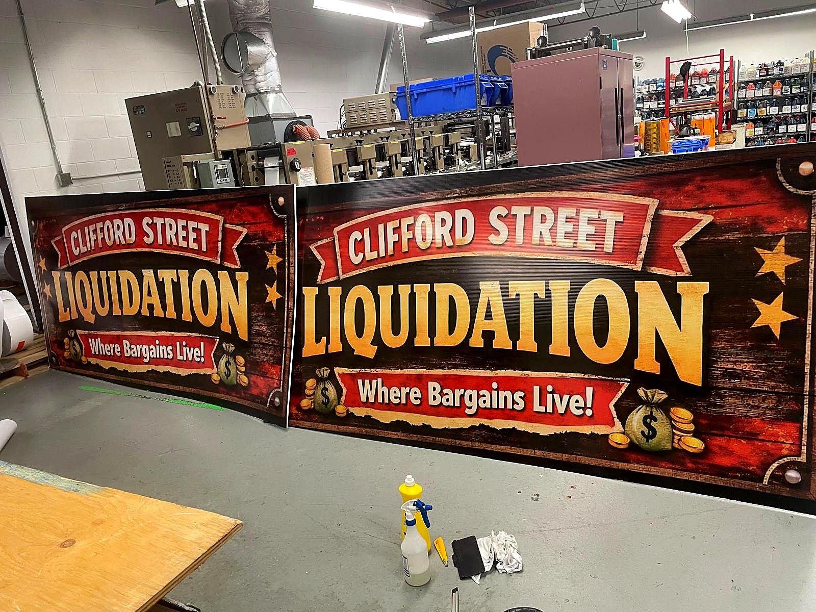 Two full-colour Clifford Street Liquidation banners