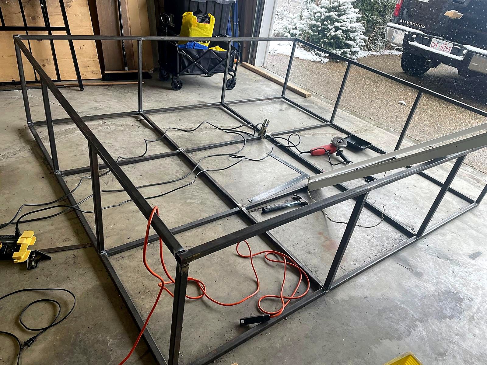 Welded steel frame for a sign cabinet on the shop floor